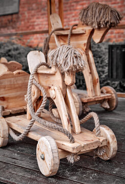 Wooden retro toy handmade horse with wheels and rope traditional joinery craft.