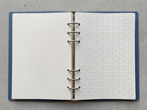 Open binder with blank paper and grid pattern page notebook stationery