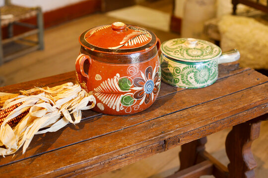 Painted Mexican Ceramic Pots on Wooden Table