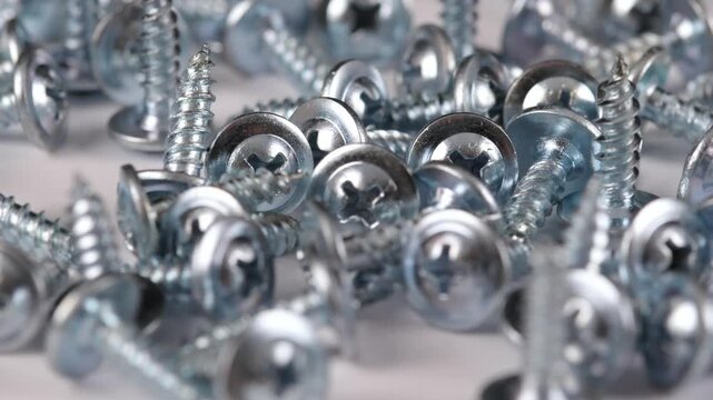 Metal screws for fastening equipment. Soft focus. Close-up. 