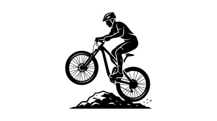 Fototapeta premium Mountain biker performing a jump on rocky terrain.