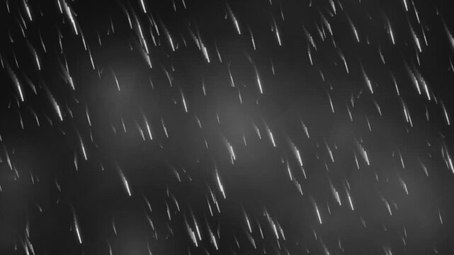 Black and white rain of snow falling at night against dark background, atmospheric storm cinematic footage effect.