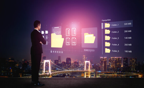 Professional businessman analyzes digital folders and data while standing against a vibrant city skyline at night, illustrating the intersection of technology and urban life. Ledger