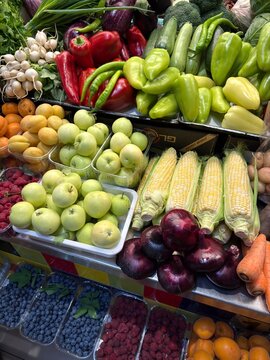Fresh Fruits Vegetables and Berries Display at Local Farmers Market