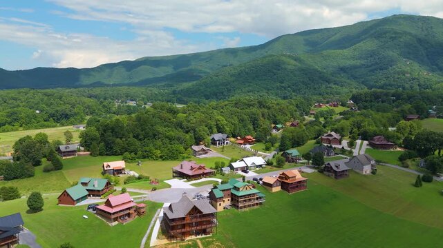 Mountain houses among green trees in Wears Valley, Tennessee and dramatic peaks with panoramic views in a quiet highland resort community