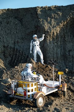 Exploration of the moon with astronauts and a lunar rover during a bright day