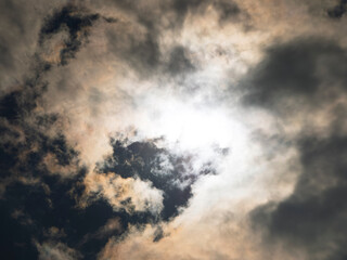 Obraz premium Dramatic Stormy Sky with Bright Sun Peaking Through Dark Clouds
