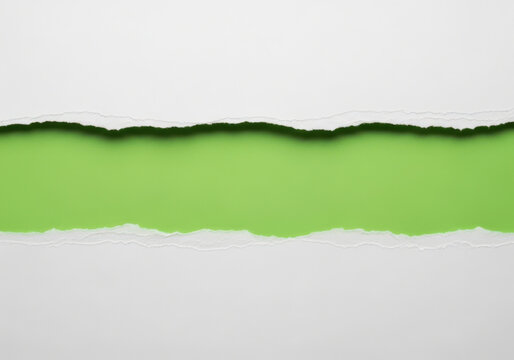 A horizontal strip of bright green paper revealed by torn white layers