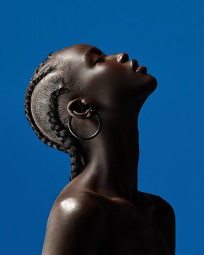 Black woman with braids on blue background