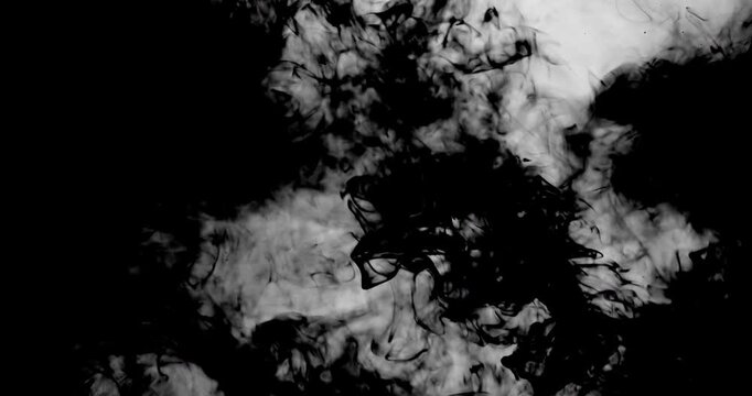 Smoke swirls across a dark, gradient background