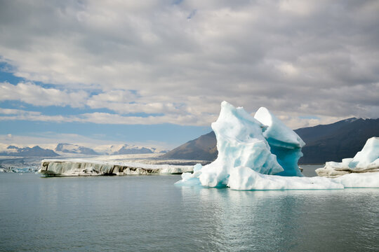 Sculpted iceberg with a turquoise arch