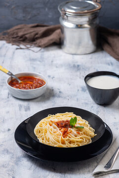 Spaghetti Pasta Served with Garlic Yogurt and Red Pepper Tomato Sauce