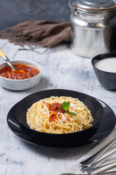 Spaghetti Pasta Served with Garlic Yogurt and Red Pepper Tomato Sauce