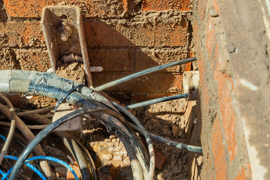 Telecoms access chamber interior with copper distribution cables and ducts