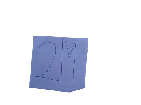 Handwritten blue 2m on a white paper square against a solid , simple lettering and numeral.keywords