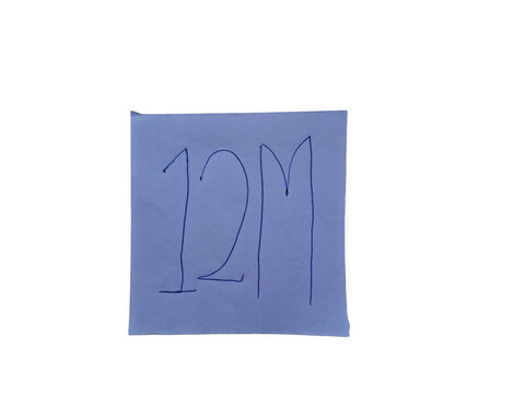 Handwritten blue marker '12m' on a square piece of light blue paper , showing a large number