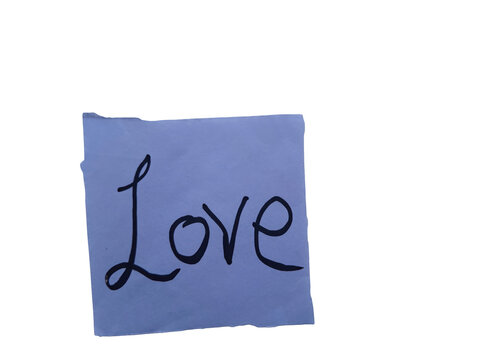 Handwritten "love" message on a light blue paper note, , expressing affection and emotion