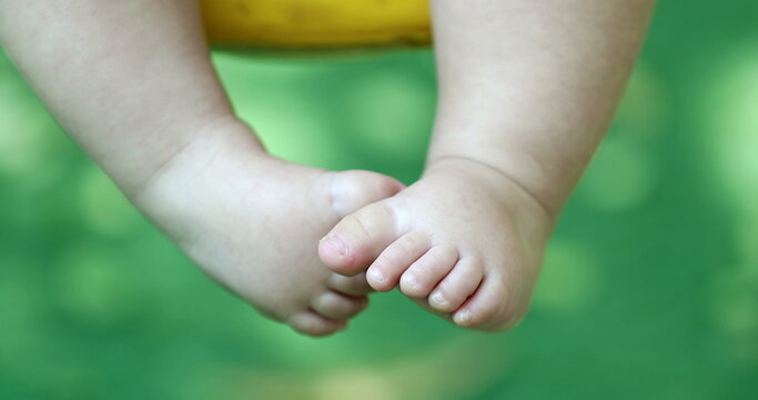 Cute baby infant boy closeup legs and foot outside