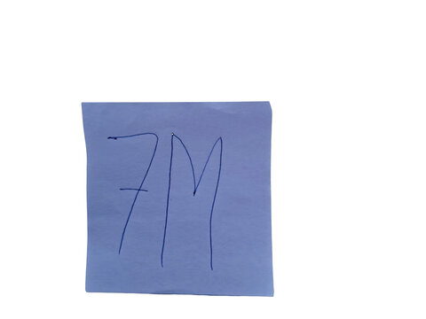 Light blue paper with handwritten 7m in dark blue ink, , simple text notation.keywords