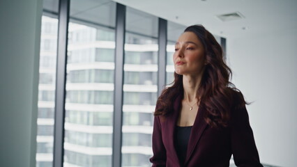 Fototapeta premium Closeup businesswoman walking hall modern center. Joyful elegant woman hurrying