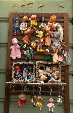 Traditional wooden marionettes and plush puppets displayed outside souvenir shop in Bratislava. Slovakia
