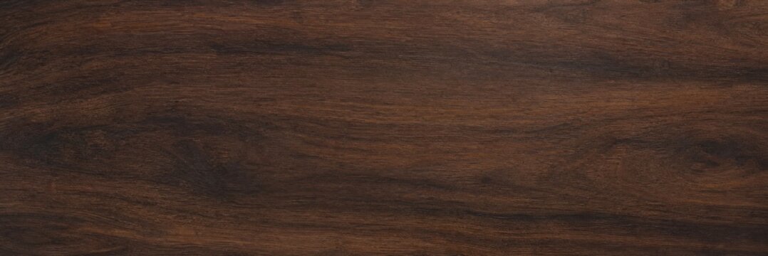 Dark walnut wood texture background, polished mahogany timber surface with natural grain patterns, elegant brown wooden board for interior design mockups and furniture product displays