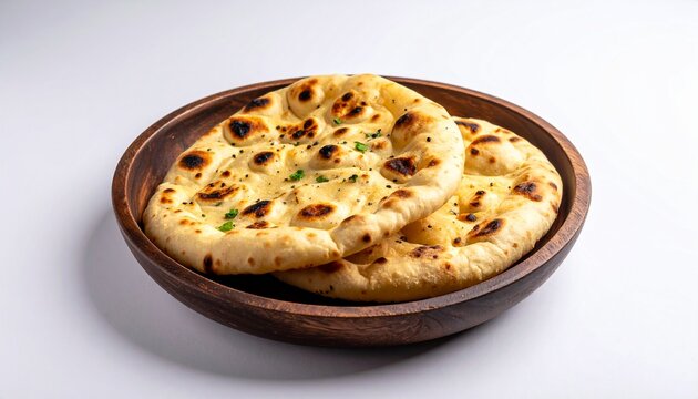 "Golden-brown naan bread with char marks, symbolizing traditional South Asian cuisine, warmth, and culinary heritage."