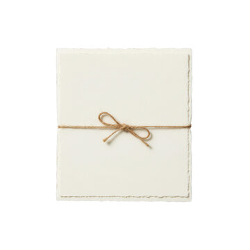 Stack of blank white paper cards tied with a rustic brown twine string bow
