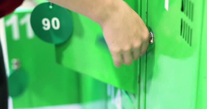 locking a storage locker at the supermarket entranc