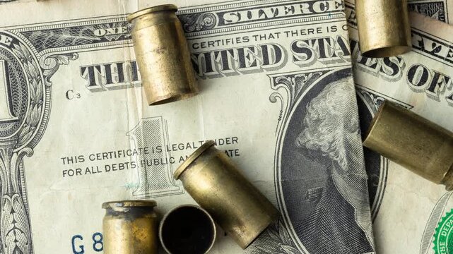 Used old ammunition casings over dollar bills