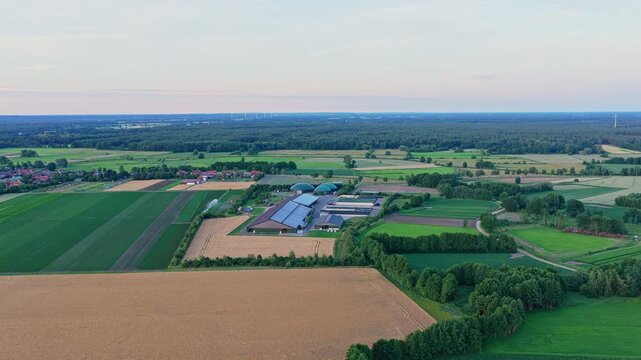 Photovoltaic technology for eco-friendly electricity production. Renewable energy solutions through solar power. Solar panel at agricultural farm with biogas plant and silage clamps storage