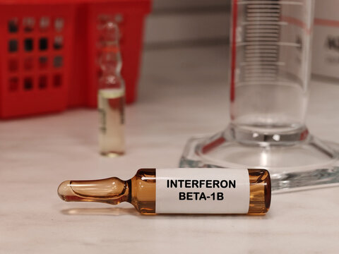 INTERFERON BETA-1B interferon therapy for relapsing multiple sclerosis in an injectable vial medical ampoule on a clinical laboratory table