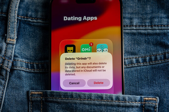 Delete Grindr dating app confirmation on smartphone screen. Toronto, Canada - July 24, 2026.