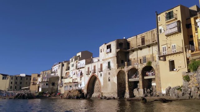 Low Angle View of Historic Waterfront Buildings on the Coast of Cefalu Sicily