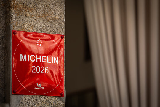 Porto, Portugal - 17 April 2026: 2026 Guide Michelin Award Label Plaque at the Facade of a freshly awarded 1-Star Restaurant; Copy Space