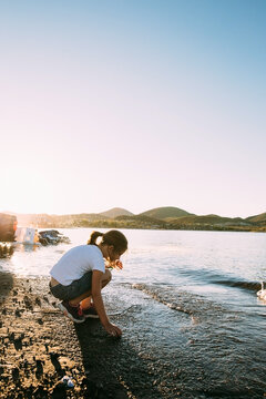 Girl Playing Along the Shoreline at Lake Pleasant, Arizona