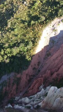 High angle aerial shot of jagged white badland crest and deep clay ravines in Kazakhstan
