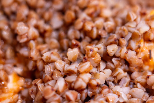 Cooked buckwheat groats with tasty vegetables in a bowl for healthy breakfast or lunch