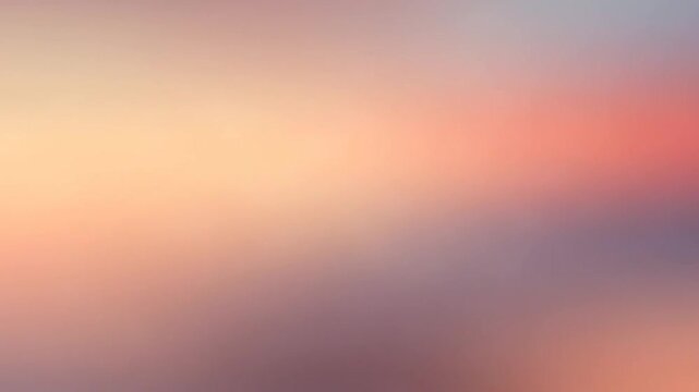 Blurred warm sunset sky with soft orange tones.