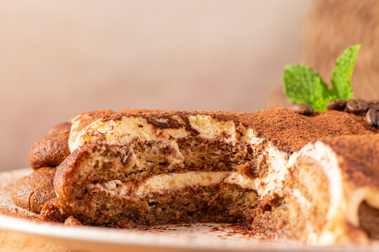 elicious homemade tiramisu cake topped with cocoa