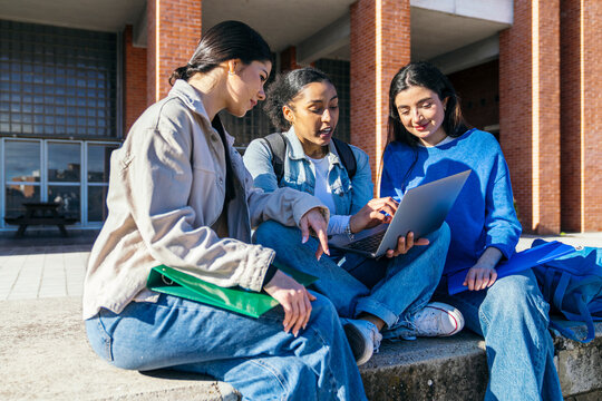 University students studying together on campus steps