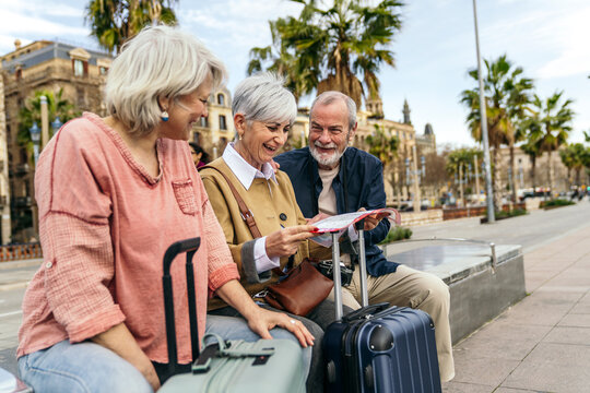 Seniors planning travel adventure in sunny city