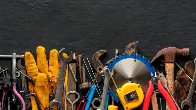 Group of worn work tools. Collection of used blue collar work equipment. For home improvement, diy repair projects, manual labor jobs, Father's day gift ideas, or to celebrate Labor Day.