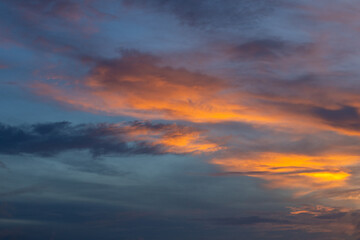 Fototapeta premium Dramatic Sunset Sky with Orange Clouds