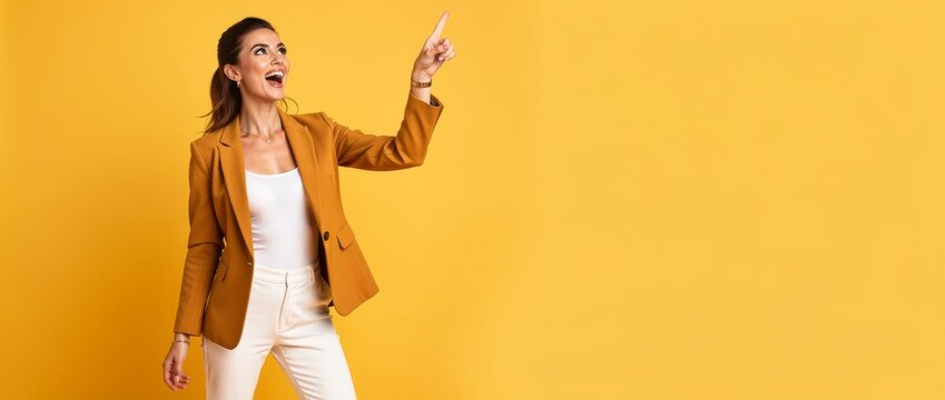 Excited woman pointing at copy space. Happy female professional showing something.