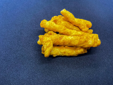 small pile of savory, Crispy Crunchy Corn Kurkure Snacks