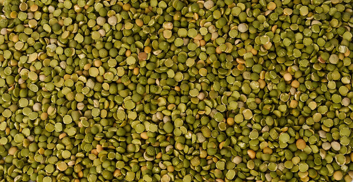 Detailed macro texture of dried split green peas filling the frame
