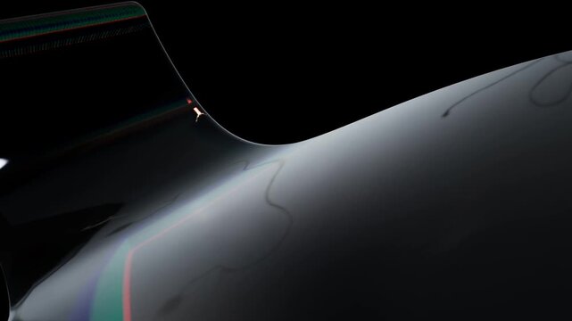 Abstract metallic surface with rainbow light refraction effect on a dark background