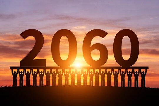 Numerous small figures silhouette in the morning sun, holding 2060