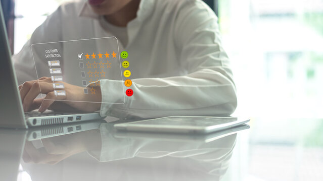Customer satisfaction survey on a laptop. Customer, satisfaction, feedback, review, rating, experience, service, quality, business, and customer experience management concept.